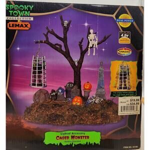 Lemax Spooky Town Caged Monster with Purple and Orange Accents